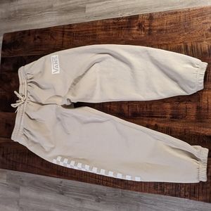 The brand is vans , the size is men's medium and the color is cream/tan